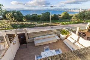 Frontline home with direct sea access, private garden and communal pool in Llucmajor
