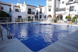 Lovely end of terrace house in the sought after Pueblo Andaluz urbanisation.