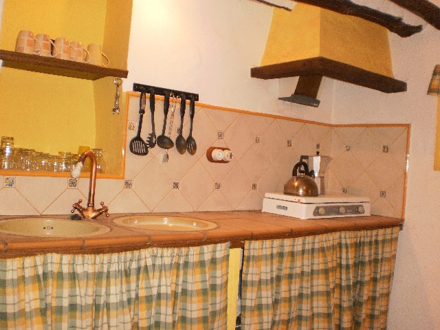 House 1 - Rustic fitted kitchen.