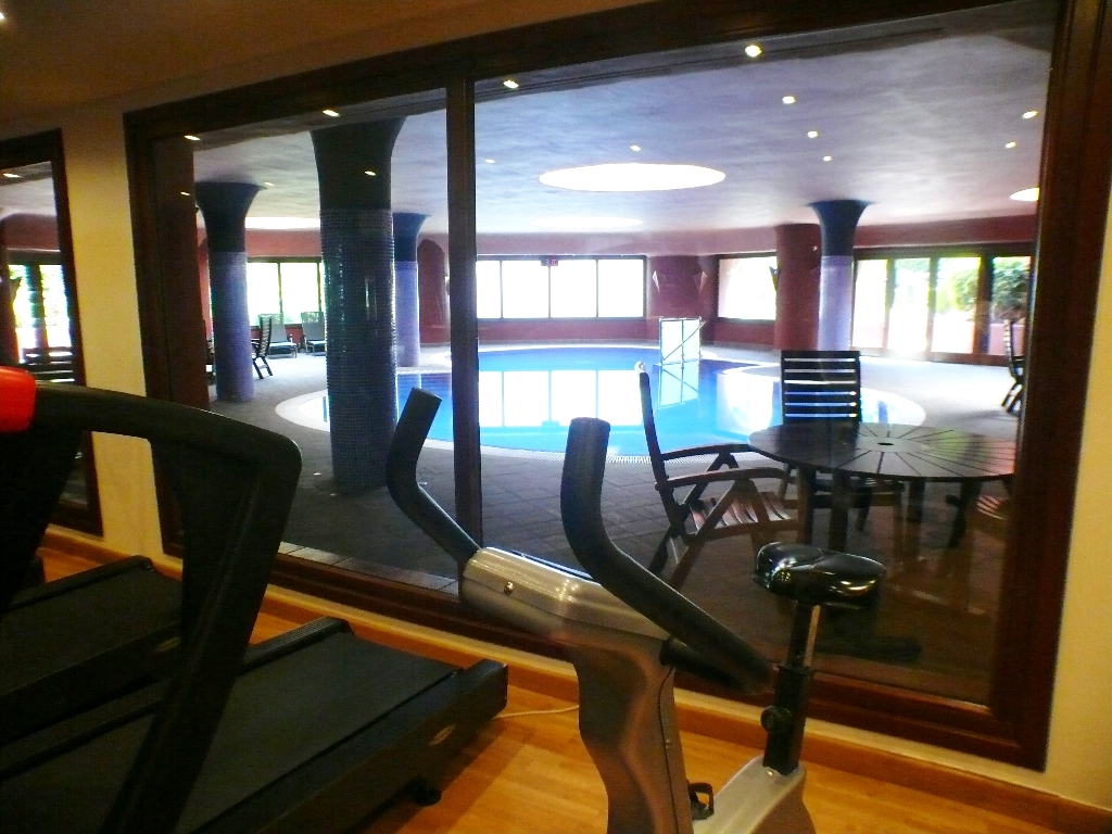 gym view into indoor pool
